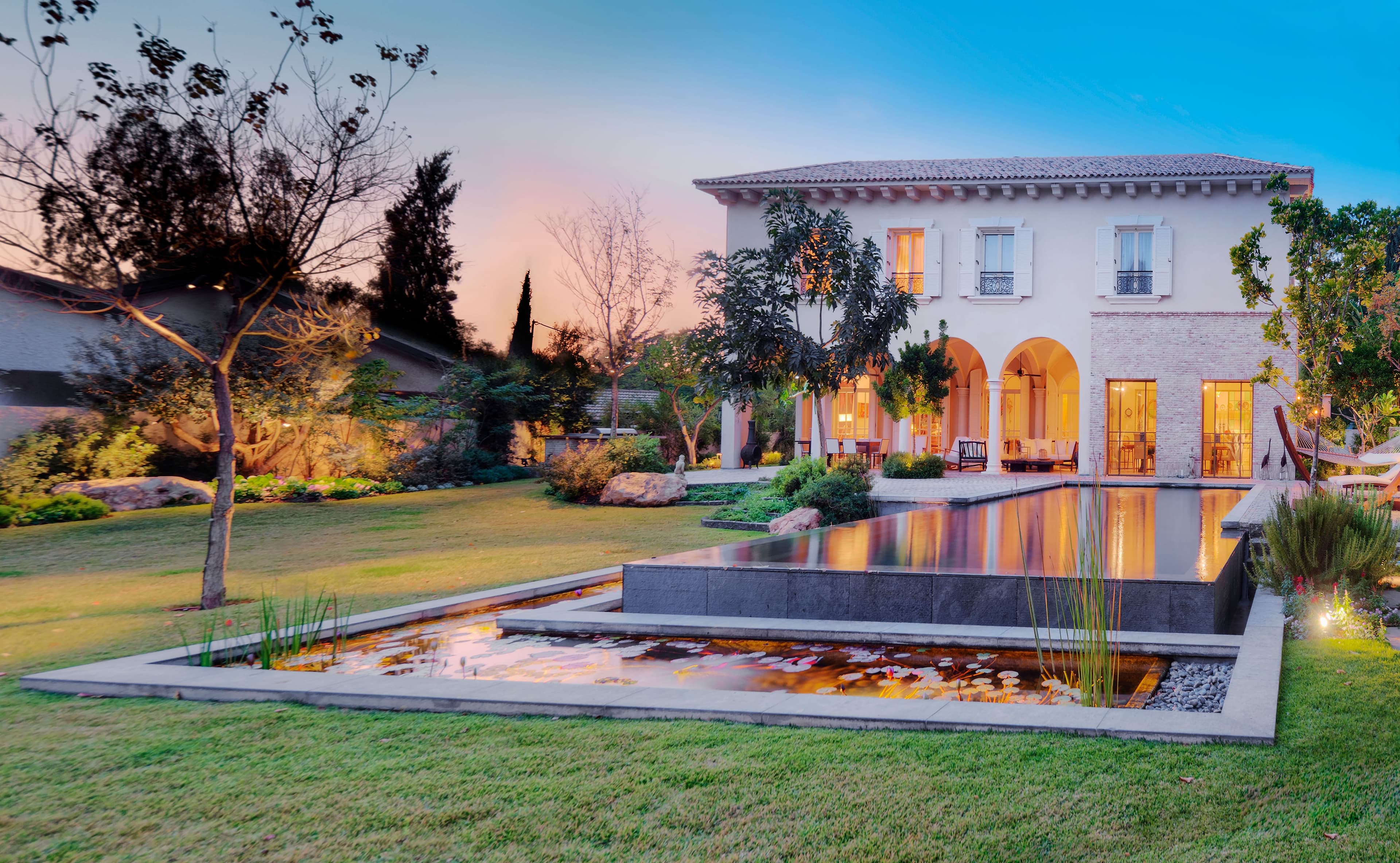 Reflections of a Beautiful Home at Dusk