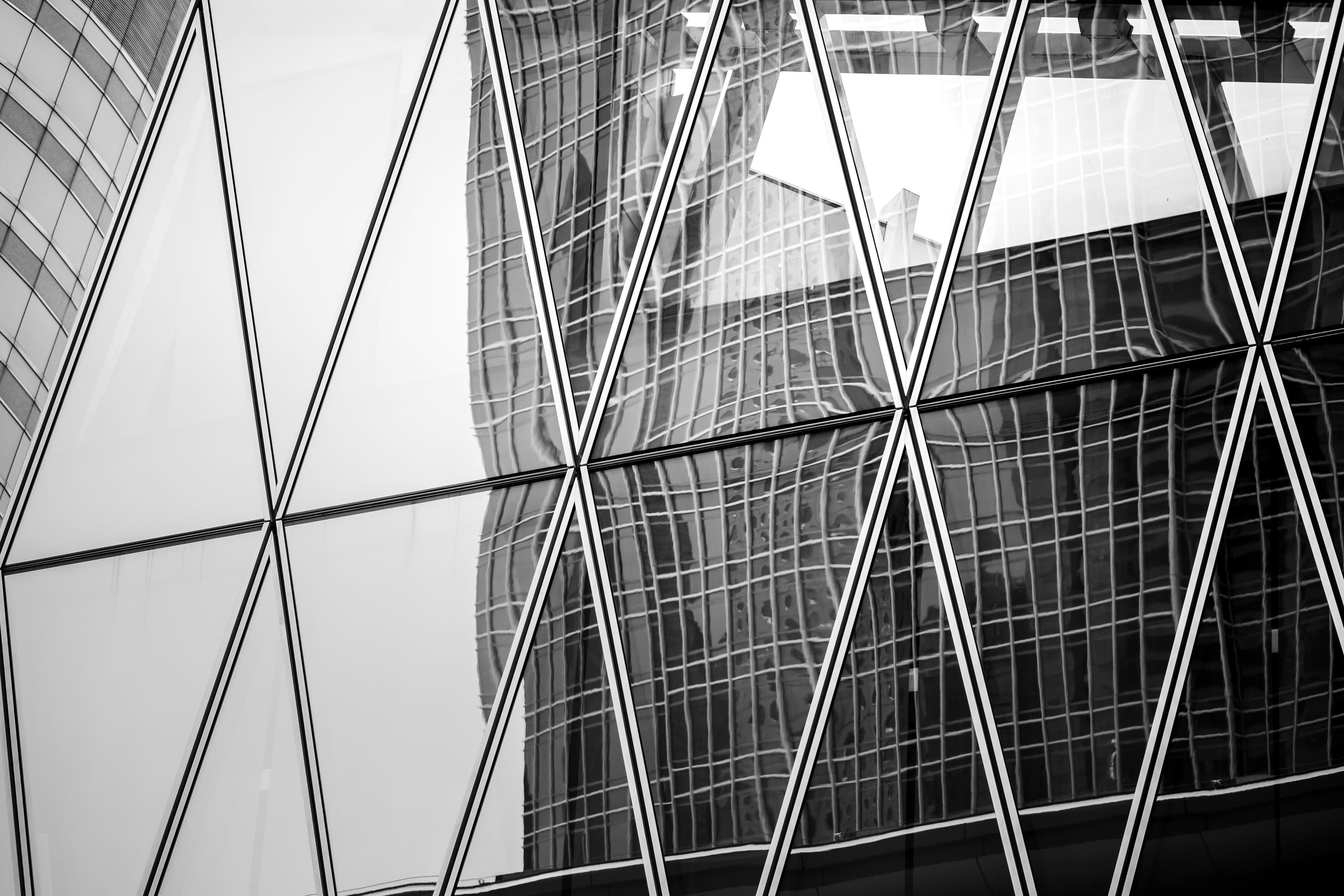 Bottom Up View Of Modern Office Building In Hong Kong In B&W Color