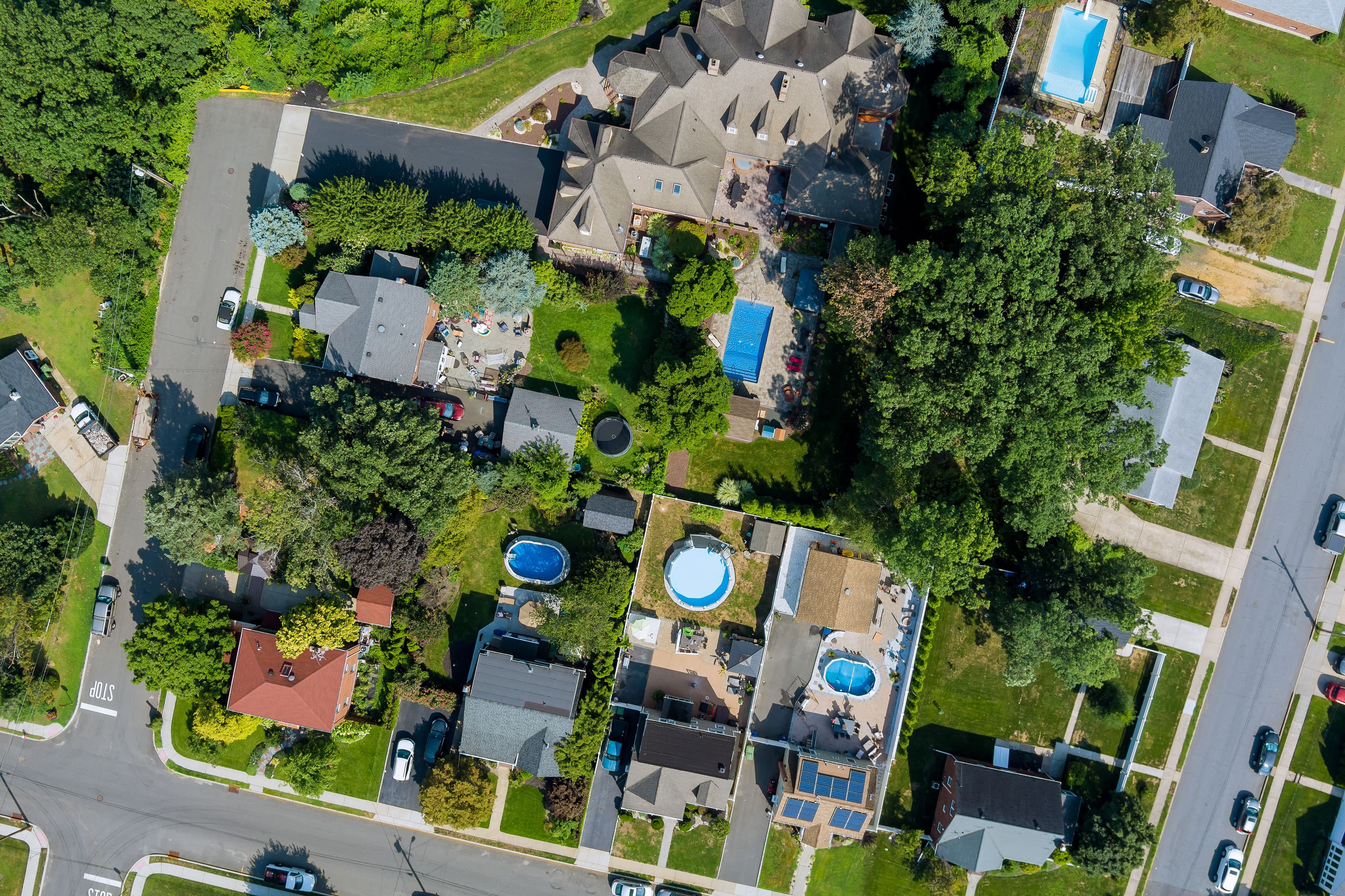 Suburban Homes with Swimming Pools Aerial View