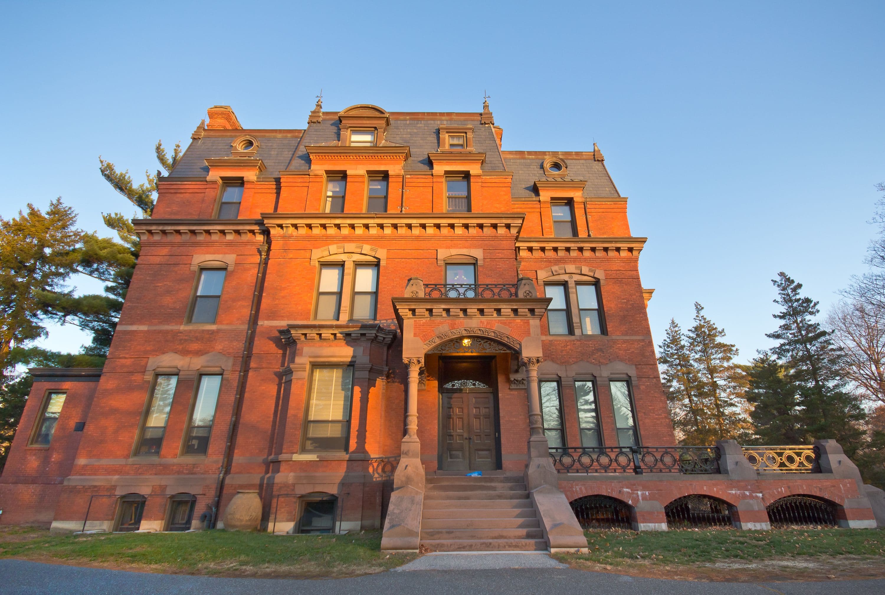 A Brick Victorian Church Parish Building In The Glow Of Morning Sunlight